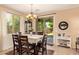 Bright dining area with views of the backyard through sliding glass doors and natural light at 6482 S Claiborne Ave, Gilbert, AZ 85298
