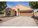 Charming single-story home featuring a tile roof, a two-car garage and low maintenance desert landscaping at 6482 S Claiborne Ave, Gilbert, AZ 85298