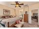 The main bedroom includes a king bed, neutral walls, and views to the main bath at 6482 S Claiborne Ave, Gilbert, AZ 85298