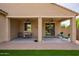Covered patio area perfect for outdoor dining and relaxation with ceiling fans at 6482 S Claiborne Ave, Gilbert, AZ 85298