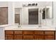 Bathroom featuring double sinks, spacious counter space, and decorative tile at 6853 S Roosevelt St, Tempe, AZ 85283