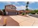Charming two-story home featuring a tile roof, spacious driveway and desert landscaping at 6853 S Roosevelt St, Tempe, AZ 85283