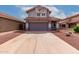 Two-story home with a tile roof, gray stucco, a two-car garage and desert landscaping at 6853 S Roosevelt St, Tempe, AZ 85283