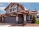 Charming home featuring gray siding, a tile roof, a two-car garage, and desert landscaping at 6853 S Roosevelt St, Tempe, AZ 85283