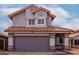 Two-story home showcasing a tiled roof and a gray two-car garage at 6853 S Roosevelt St, Tempe, AZ 85283
