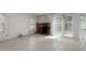 Comfortable living room features a brick fireplace and sliding glass door at 6853 S Roosevelt St, Tempe, AZ 85283