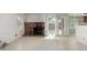 Inviting living room featuring a brick fireplace and sliding glass door access to the backyard at 6853 S Roosevelt St, Tempe, AZ 85283