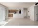 Bright, tiled living space with view into kitchen with ample natural light at 6853 S Roosevelt St, Tempe, AZ 85283
