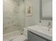 Modern bathroom featuring a marble-tiled shower and a sleek vanity with contemporary fixtures at 6945 E Osborn Rd # E, Scottsdale, AZ 85251
