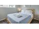 A cozy bedroom with natural light, a queen-size bed, and simple furnishings at 6945 E Osborn Rd # E, Scottsdale, AZ 85251