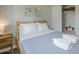 Cozy bedroom featuring a minimalist style, a comfortable bed, and ample closet space at 6945 E Osborn Rd # E, Scottsdale, AZ 85251