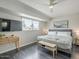 Serene bedroom with a large window, mounted TV, bench, and contemporary decor at 6945 E Osborn Rd # E, Scottsdale, AZ 85251