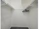 Clean and organized closet with shelves, hanging rod, and ample storage space at 6945 E Osborn Rd # E, Scottsdale, AZ 85251