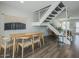 Dining room view features dining table, staircase and minimalist decor at 6945 E Osborn Rd # E, Scottsdale, AZ 85251