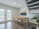 Dining room showcases a table with chairs, French doors and modern accents at 6945 E Osborn Rd # E, Scottsdale, AZ 85251