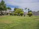 Lush green lawn, landscaping, and mature trees in this well-maintained property at 6945 E Osborn Rd # E, Scottsdale, AZ 85251