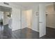 Hallway featuring closet, doorways, and neutral paint at 6945 E Osborn Rd # E, Scottsdale, AZ 85251