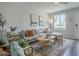 Bright living room featuring a comfy sectional sofa, area rug and decor at 6945 E Osborn Rd # E, Scottsdale, AZ 85251