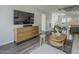 Open-concept living area with contemporary furnishings, stairs, and stylish accents at 6945 E Osborn Rd # E, Scottsdale, AZ 85251