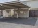 Assigned and covered parking spaces and storage sheds for residents at 6945 E Osborn Rd # E, Scottsdale, AZ 85251
