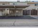 Covered parking area with reserved parking spaces and convenient storage units at 6945 E Osborn Rd # E, Scottsdale, AZ 85251