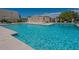 Large community pool with sparkling water and comfortable lounging area at 6945 E Osborn Rd # E, Scottsdale, AZ 85251