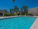Sparkling community pool with lounge chairs for relaxing and soaking up the sun at 6945 E Osborn Rd # E, Scottsdale, AZ 85251