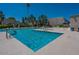Beautiful community pool with crystal clear water on a sunny day at 6945 E Osborn Rd # E, Scottsdale, AZ 85251