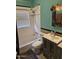 Bathroom with white tile, bathtub, sink and vanity with medicine cabinet at 723 E Moreland St, Phoenix, AZ 85006