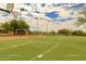 A full basketball court under a bright sky, ideal for sports and recreation within the community at 7445 E Eagle Crest Dr # 1061, Mesa, AZ 85207