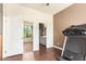Bedroom with wood floors features a sitting area and a bathroom at 7445 E Eagle Crest Dr # 1061, Mesa, AZ 85207