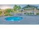 Relaxing community hot tub with an outdoor dining area and beautiful desert landscaping at 7445 E Eagle Crest Dr # 1061, Mesa, AZ 85207
