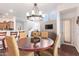 Open dining area features a chandelier over a wood table and seating, with views into the living room at 7445 E Eagle Crest Dr # 1061, Mesa, AZ 85207