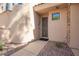 Close up of the front door with detailed security screen, desert landscape and neutral paint at 7445 E Eagle Crest Dr # 1061, Mesa, AZ 85207
