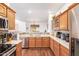 Spacious kitchen with stainless steel appliances and hardwood floors looks out over the dining and living spaces at 7445 E Eagle Crest Dr # 1061, Mesa, AZ 85207