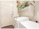 Laundry room with washer, dryer, utility sink, and storage shelves at 7445 E Eagle Crest Dr # 1061, Mesa, AZ 85207