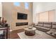 Inviting living room with a modern fireplace, recessed lighting, and a luxurious sectional sofa at 7445 E Eagle Crest Dr # 1061, Mesa, AZ 85207