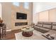 Inviting living room with a modern fireplace, recessed lighting, and a luxurious sectional sofa at 7445 E Eagle Crest Dr # 1061, Mesa, AZ 85207