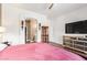 Bedroom features a hardwood floors, with a large TV and ensuite bathroom at 7445 E Eagle Crest Dr # 1061, Mesa, AZ 85207