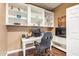 Office features wood floors, built-in shelving, desk, and computer equipment at 7445 E Eagle Crest Dr # 1061, Mesa, AZ 85207