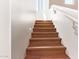 Staircase with wood treads, white risers, and a white railing at 7445 E Eagle Crest Dr # 1061, Mesa, AZ 85207