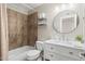 Bathroom showcasing vanity, sink, mirror, tiled shower, and toilet at 7520 E Diamond St, Scottsdale, AZ 85257