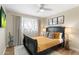 Bedroom featuring a dark wood bed frame, bright windows, and decor at 7520 E Diamond St, Scottsdale, AZ 85257