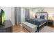 Stylish bedroom with a black metal bed frame, bench, modern decor, and soft, neutral tones at 7520 E Diamond St, Scottsdale, AZ 85257