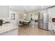 Bright and open kitchen and dining space featuring stainless steel appliances and backyard access at 7520 E Diamond St, Scottsdale, AZ 85257