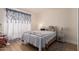 Comfortable bedroom features a cozy quilt, natural lighting, and neutral decor at 7808 E Lewis Ave, Scottsdale, AZ 85257