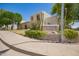 Landscaped entrance sign surrounded by vibrant greenery, inviting residents to the welcoming community at 7808 E Lewis Ave, Scottsdale, AZ 85257