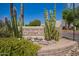 Community entrance sign with decorative cactus and desert landscaping, welcoming residents and visitors at 7808 E Lewis Ave, Scottsdale, AZ 85257