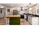 Bright kitchen featuring stainless steel appliances, center island and stylish light fixtures at 7808 E Lewis Ave, Scottsdale, AZ 85257