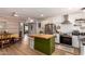 Charming kitchen features a butcher block island, stainless steel appliances, and modern white cabinetry at 7808 E Lewis Ave, Scottsdale, AZ 85257